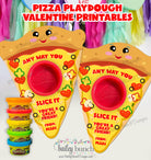Two pizza-shaped playdough containers with smiley faces and text, surrounded by additional playdough tubs.